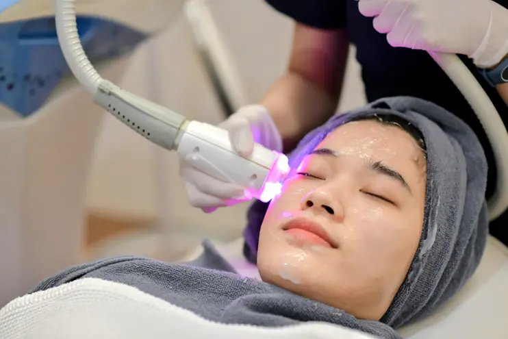 Doctor performing advanced aesthetic laser treatment in a modern cosmetic clinic in Pune